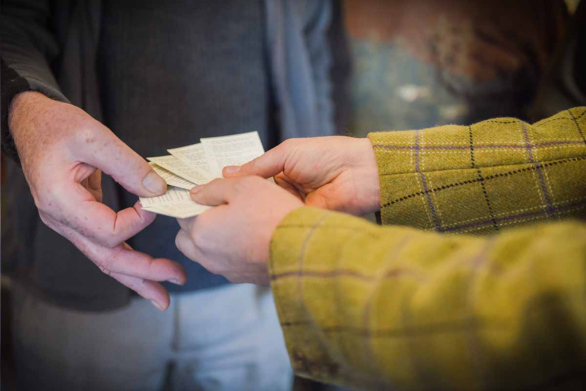 Hands getting hold of a card