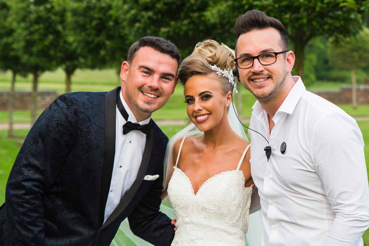 Event Manager with Bride and Groom having photograph taken in the gardens of Knowsley Hall