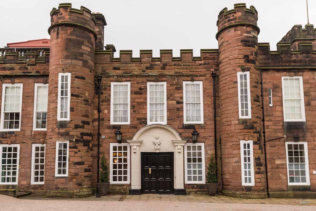 A historic building with turrets on either side 