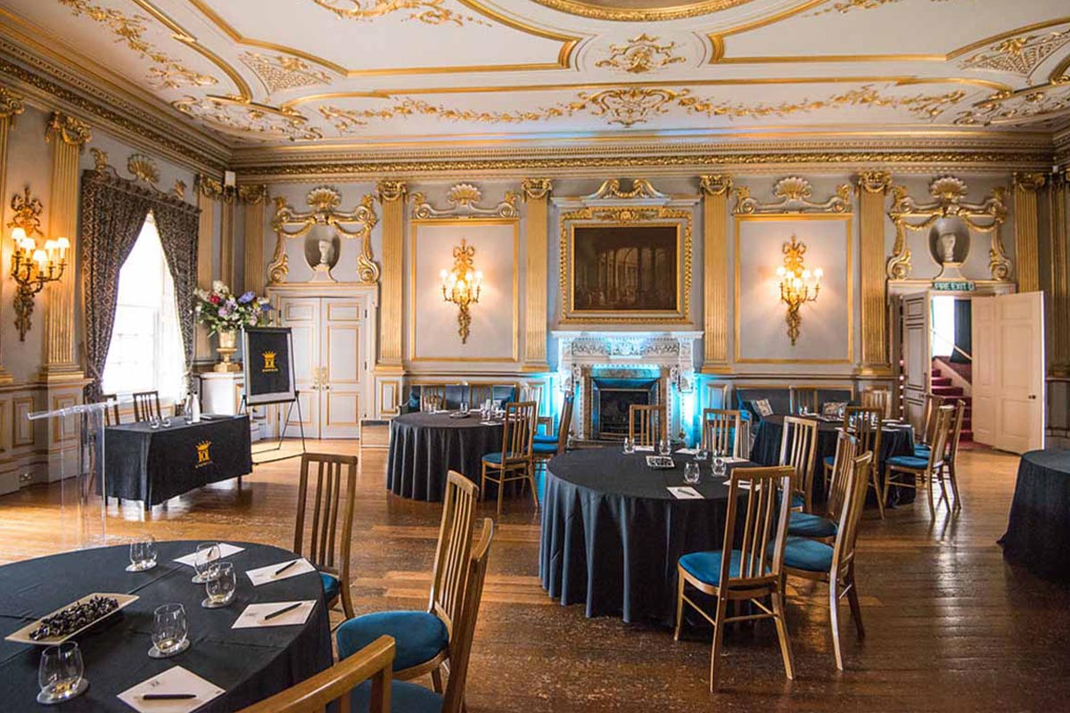Spacious and elegant room with stunning gold decor and set for a corporate conference at Knowsley Hall with competitive corporate pricing packages.